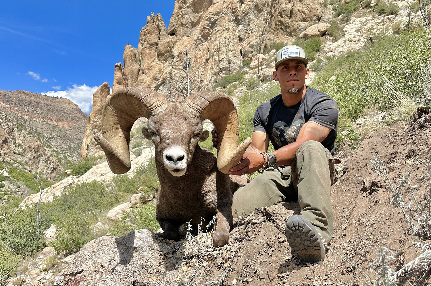 Hunter with a desert bighorn ram